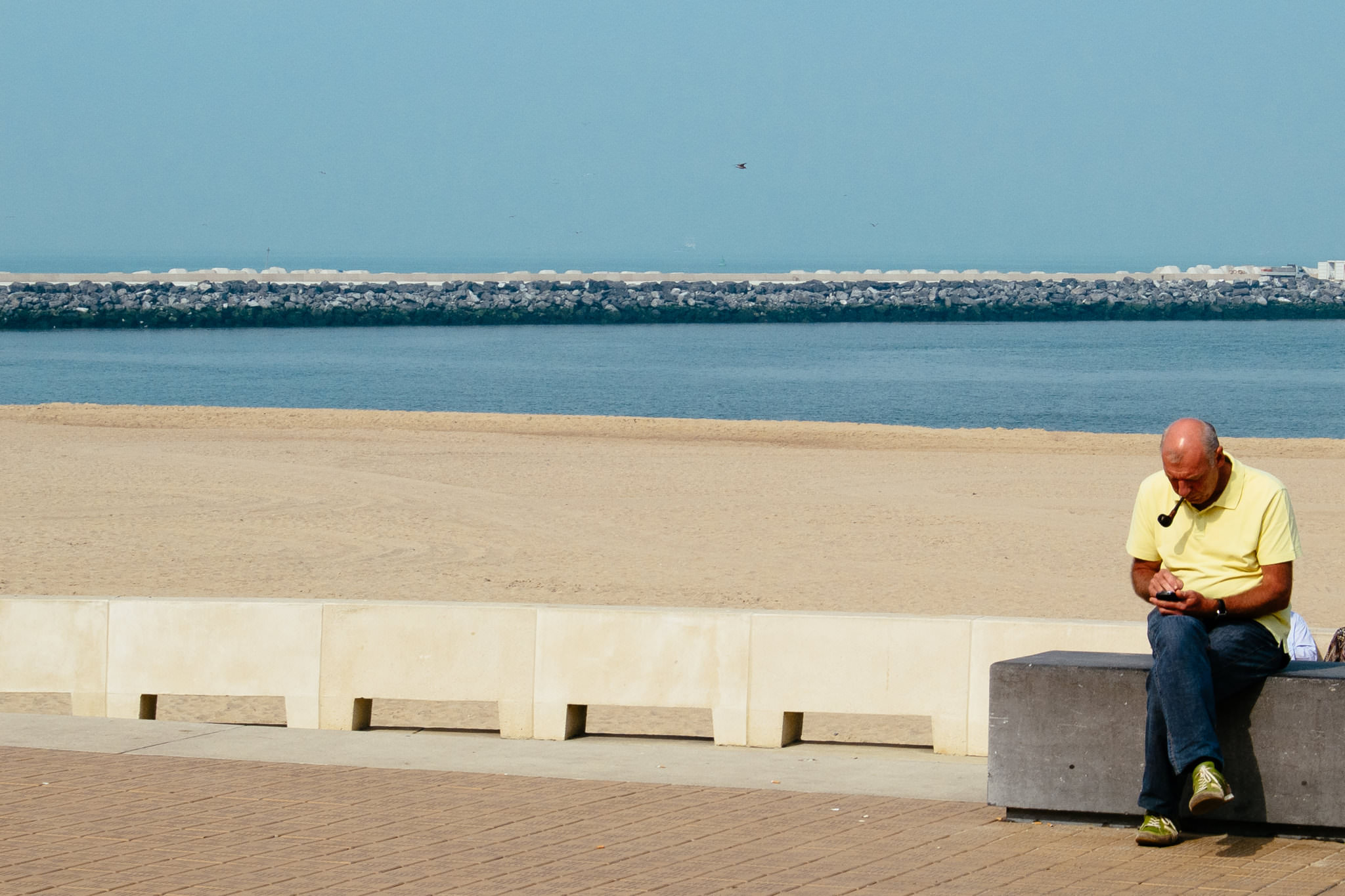 man-beach-sitting