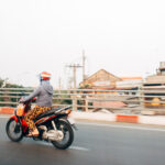 scooter-driving-saigon-street-single