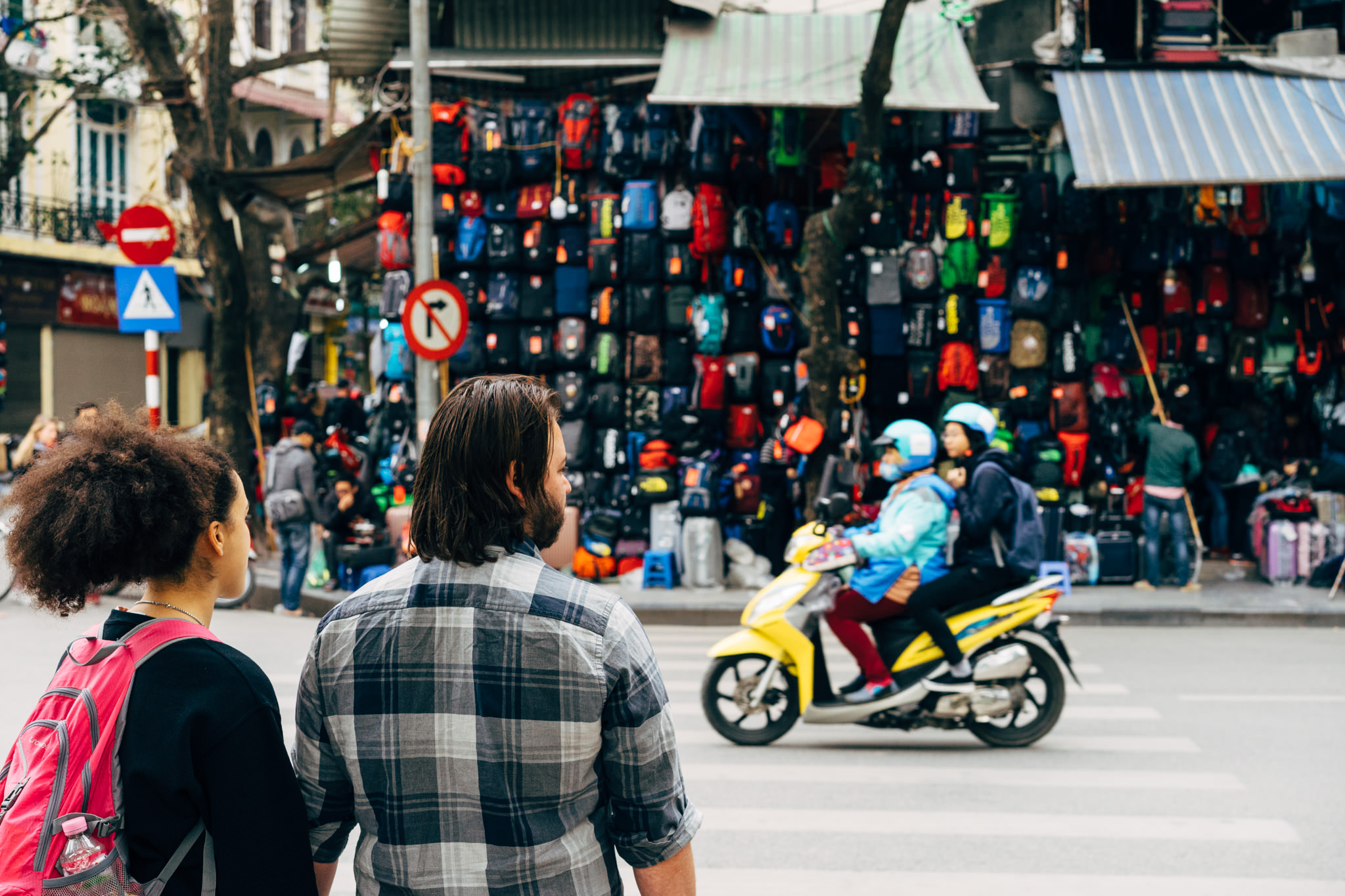 couple-crossing-scooter-hanoi-vietnam