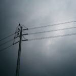 utility-pole-power-lines-stormy-sky